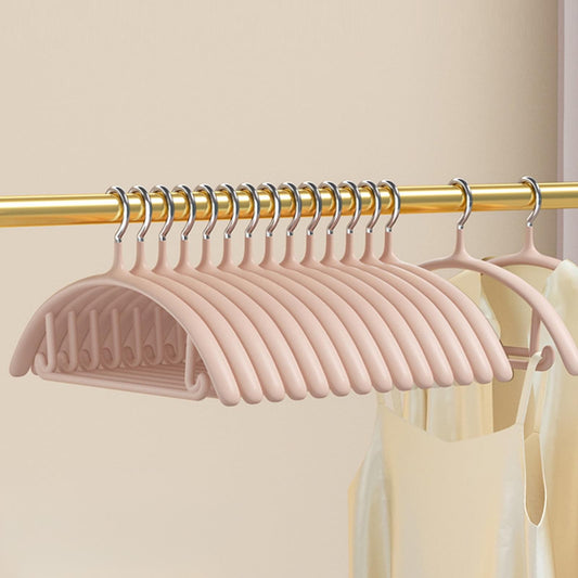 Pack of pink velvet non-slip hangers on a gold rod, showing looped hooks