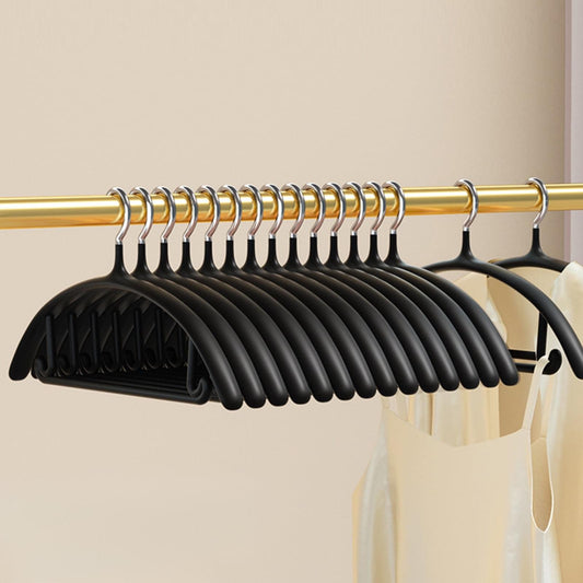Black velvet non-slip hanger set with chrome hooks on a rod, stacked view
