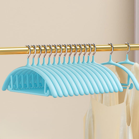 Blue velvet coat hangers with chrome hooks on a gold rod, non-slip ridges