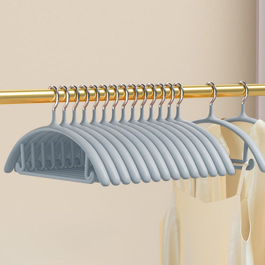 Gray velvet suit hangers with no-slip shoulder notches, stacked on a rod