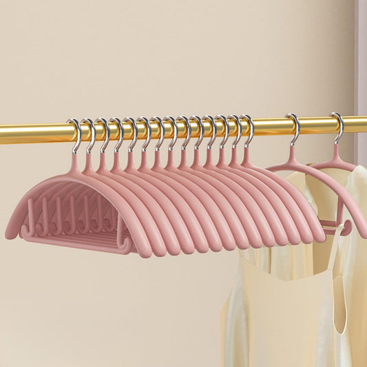 Set of pink velvet hangers on a rod with chrome hooks and non-slip ridged grips
