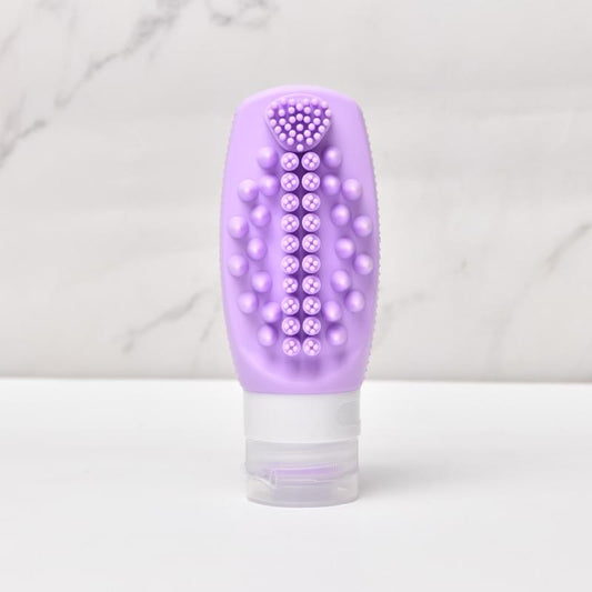 Purple silicone squeeze refill bottle with dotted scalp brush and white refill cap