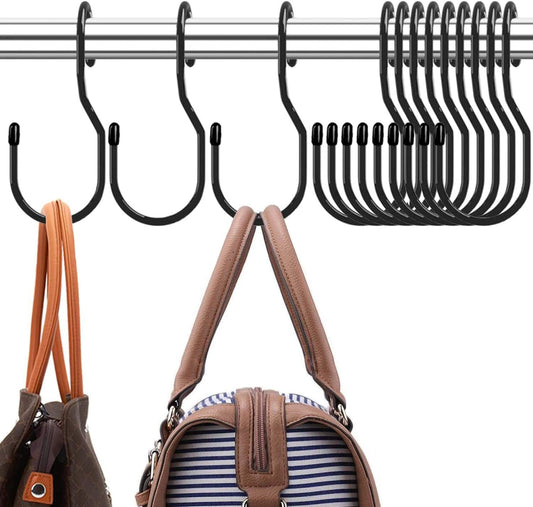 Black purse hanger hooks on a rod holding multiple bags, including tan and brown