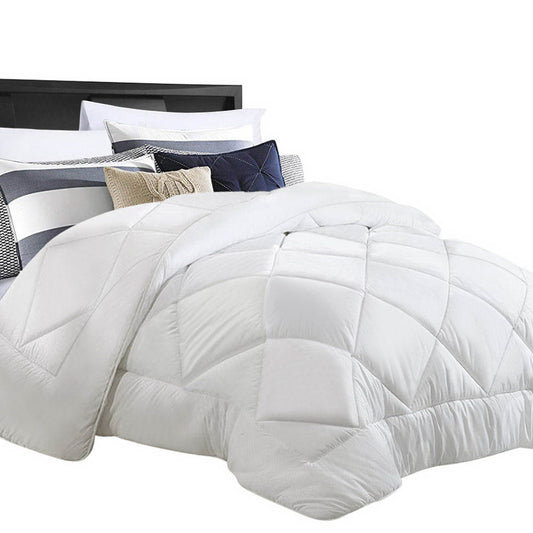 White quilted duvet with folded corner, baffle stitching and plush padded fill.