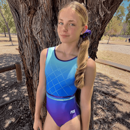 Sleeveless gradient leotard in light blue to purple with diamond rhinestone pattern