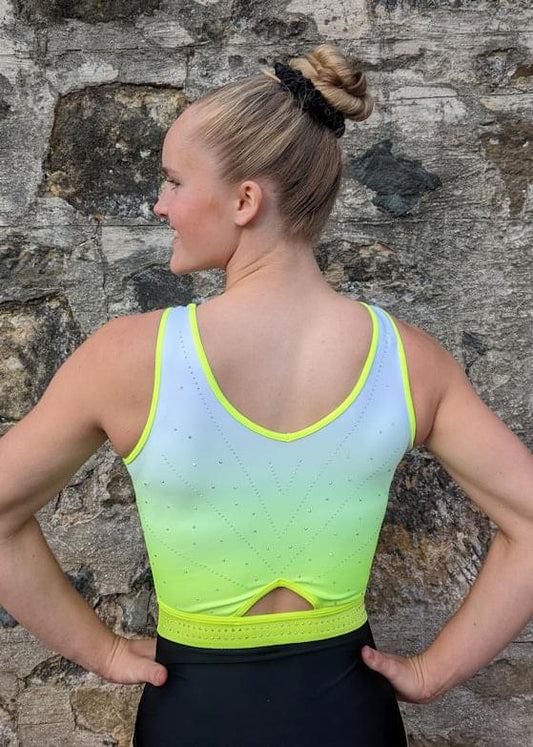 Back view neon green sleeveless leotard with white panel and dot V rhinestones