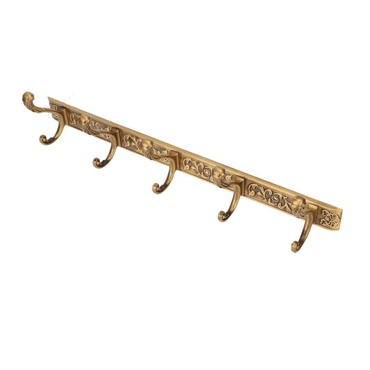 Gold coat hook rail with five curved hooks and carved scrollwork along the bar