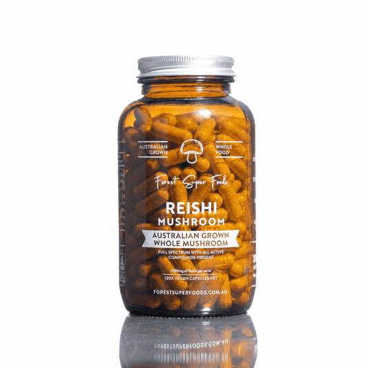 Reishi mushroom capsules bottle filled with golden-brown capsules