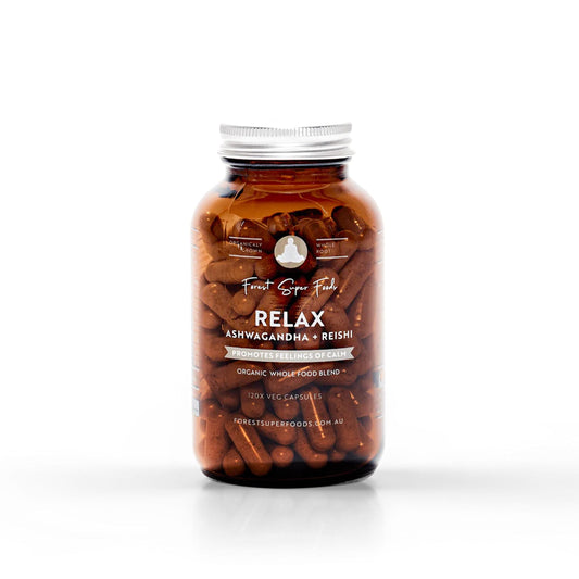 Whole food supplement bottle with amber capsules and silver screw cap