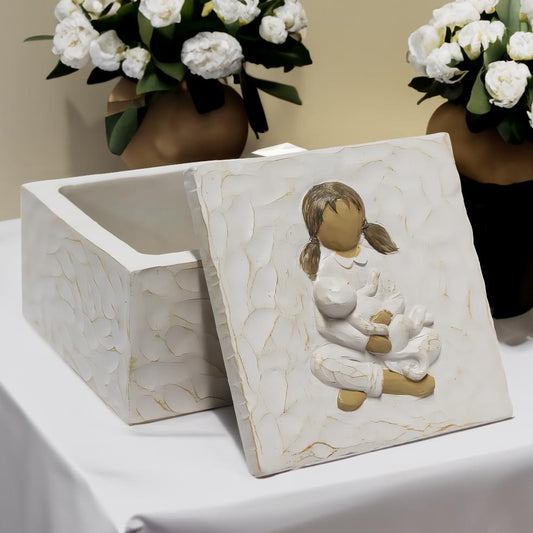White resin urn keepsake box with relief child hugging cat, side view lid open