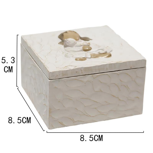 White rectangular resin urn keepsake box with relief child hugging cat, top view