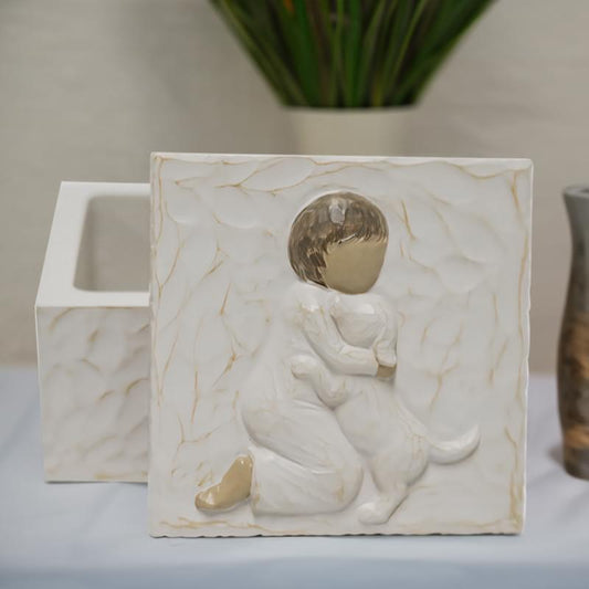 Resin pet urn keepsake box with child hugging dog relief, white marble design