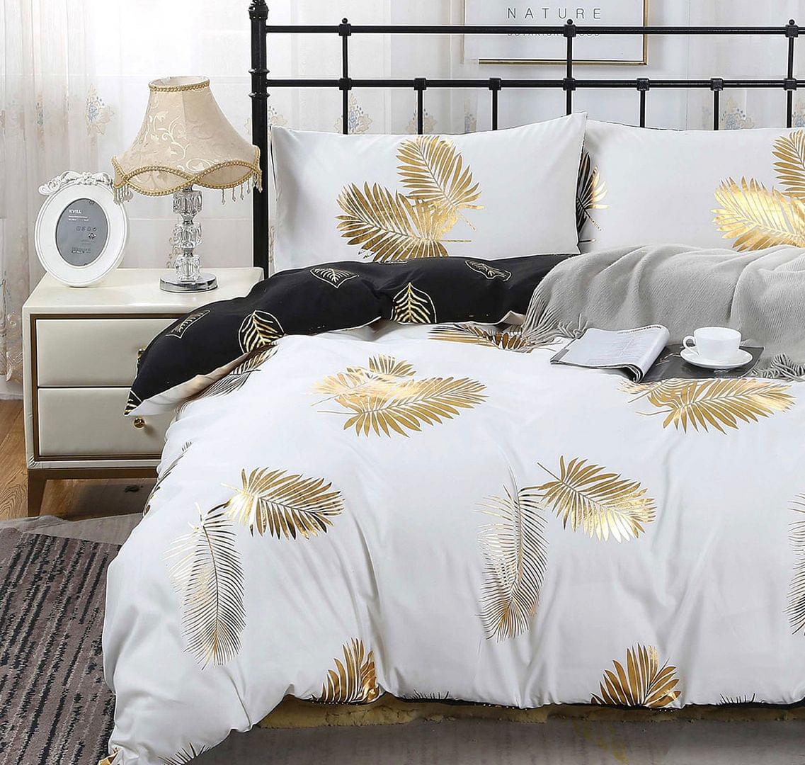 Reversible queen bed quilt set, white duvet with gold palm leaf print and black accent