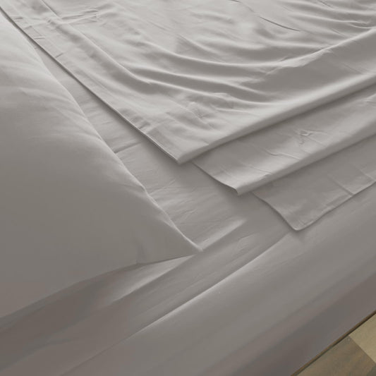 Dove gray sheet fabric with crisp creases, close-up