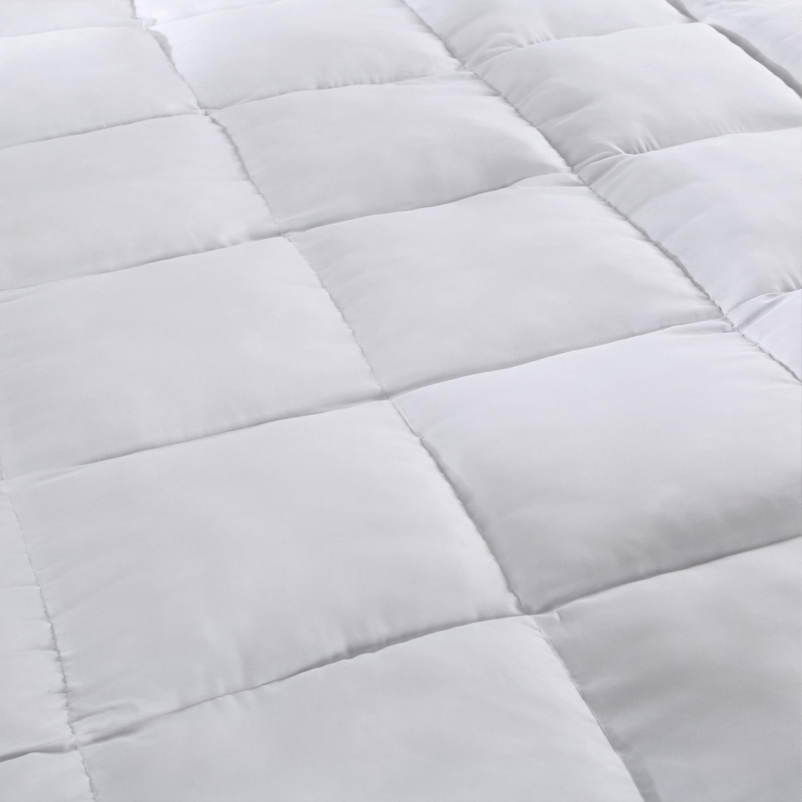White quilted mattress pad topper cover, stitched channels
