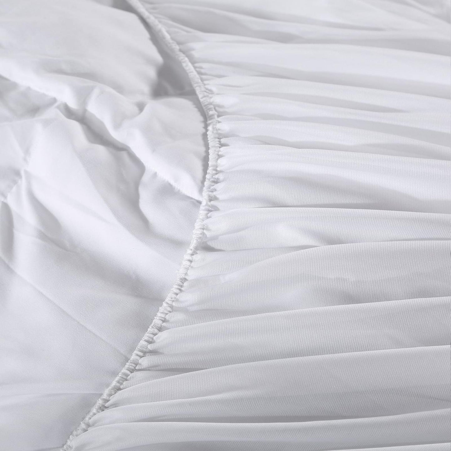 White mattress pad topper cover seam with ruffled quilted edge