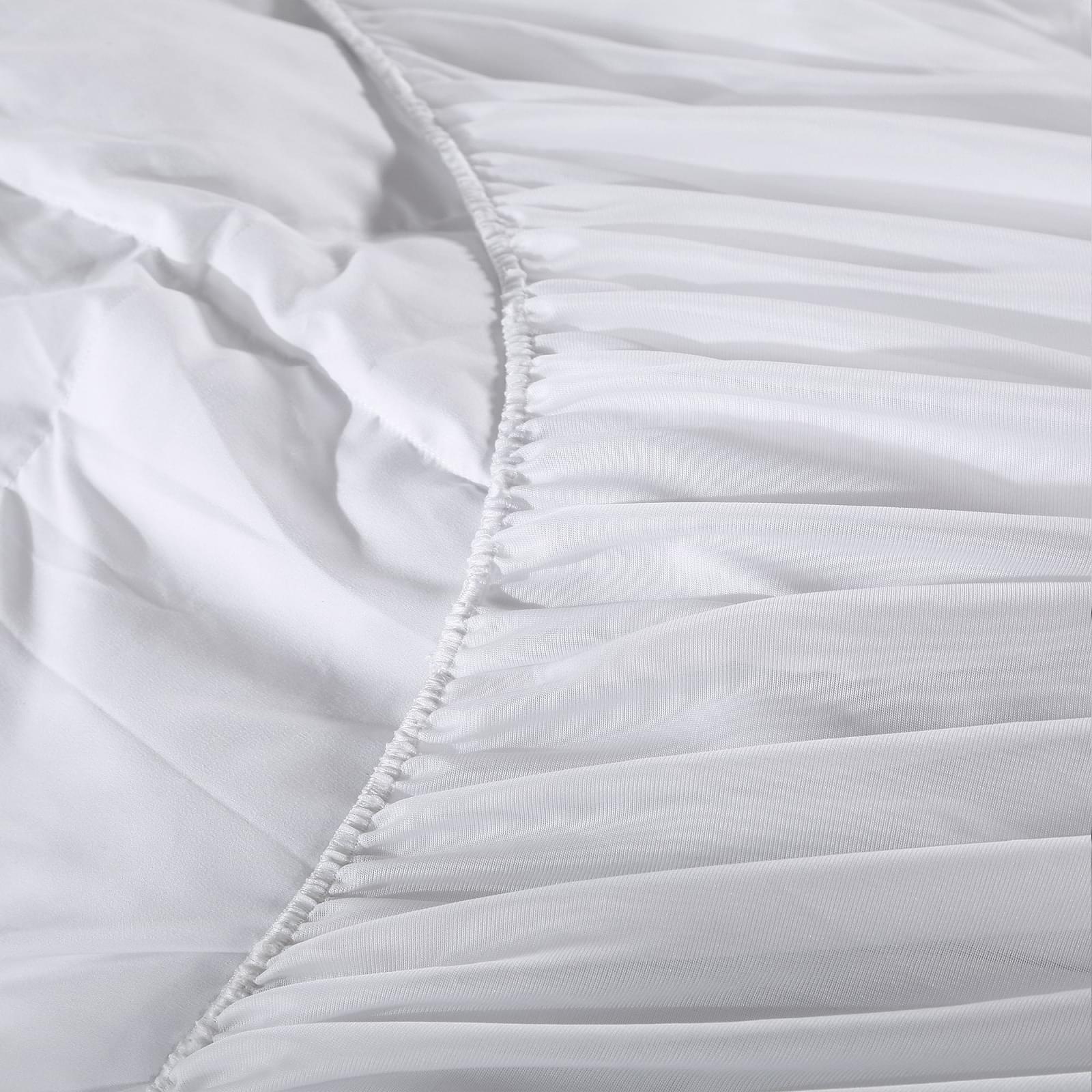 White mattress pad topper cover seam with ruffled quilted edge