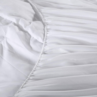 White mattress pad topper cover seam with ruffled quilted edge