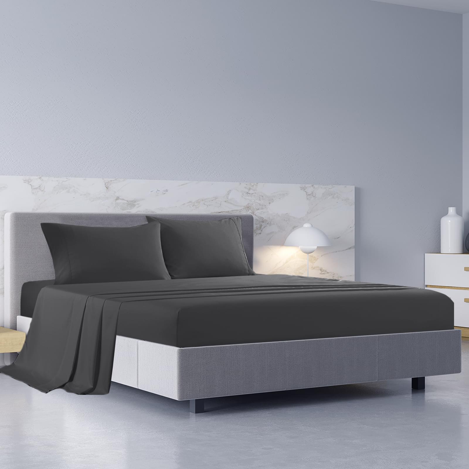 Pewter king sheet set and pillowcases on a bed with duvet cover