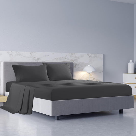 Pewter king sheet set and pillowcases on a bed with duvet cover