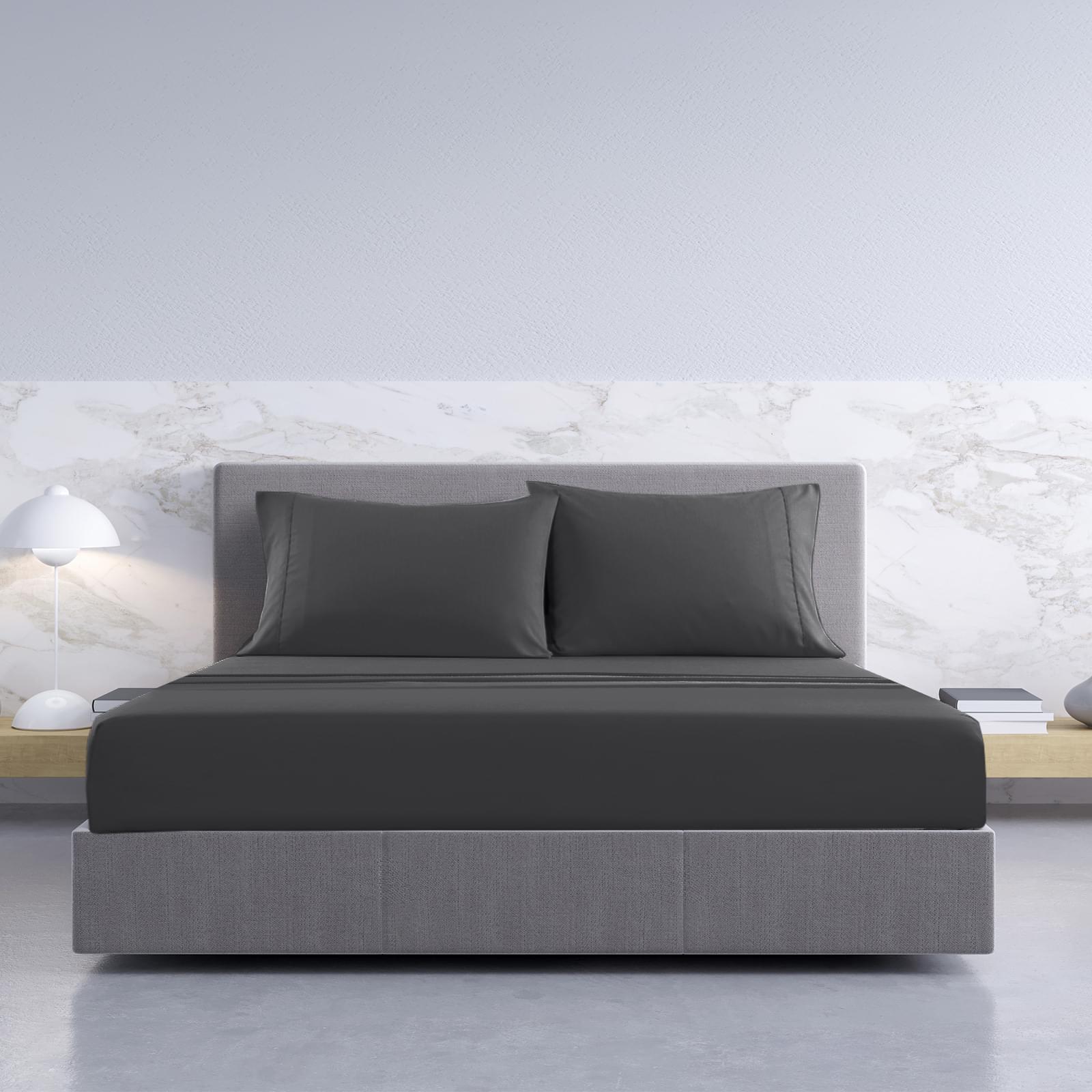 Pewter king sheet set with two pillowcases and fitted sheet on bed