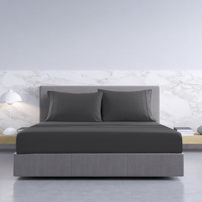 Pewter king sheet set with two pillowcases and fitted sheet on bed