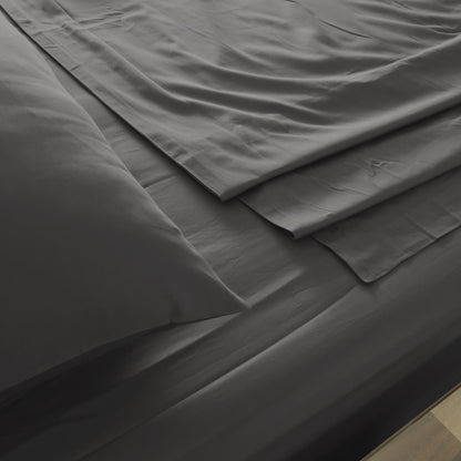 Pewter bed sheet close-up with smooth fabric layers and stitched seams