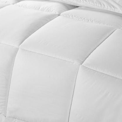 White quilted duvet panels with stitched baffle seams, close-up