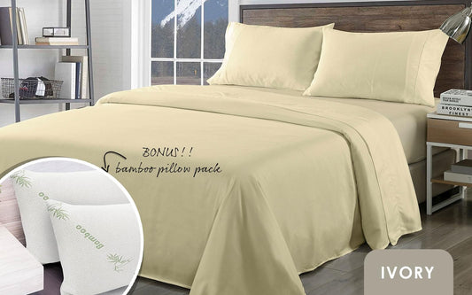 Ivory king bed sheet set with two matching pillows and smooth draped fabric