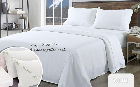White sheet set with fitted sheet and two pillows on a bed