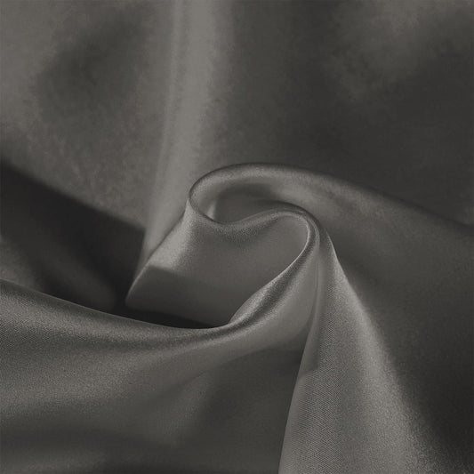 Charcoal silk pillow case with smooth sheen and folded fabric texture