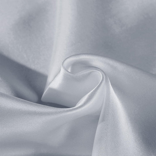 Silver silk pillow case fabric close-up with smooth sheen