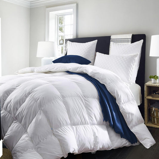 King-size white duvet on bed with quilted texture and baffle stitching