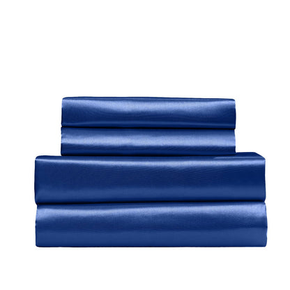 Folded navy satin king sheet set pieces