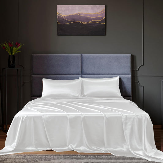 White satin sheet set on king bed, fitted sheet and two pillowcases