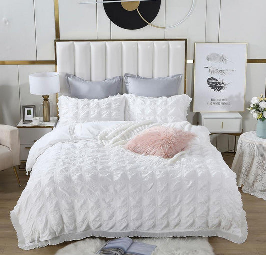 White textured jacquard duvet quilt cover set with ruffled trim and folded corner details