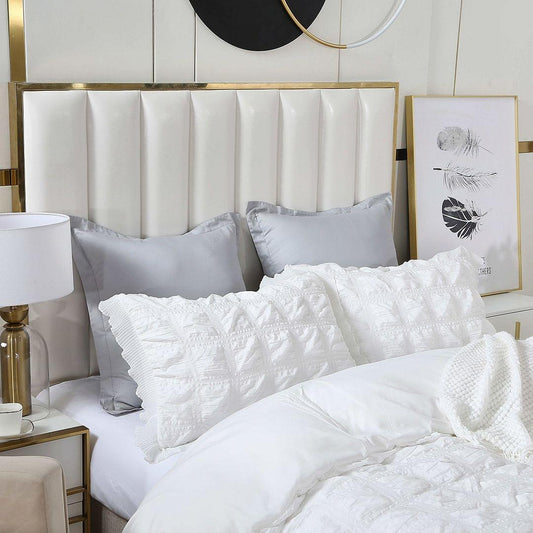 White textured duvet cover with ruffled pattern and matching pillow covers