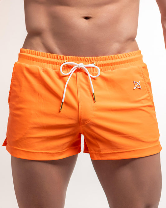 Orange 3-inch swim shorts with elastic waistband, white drawstring, side logo detail