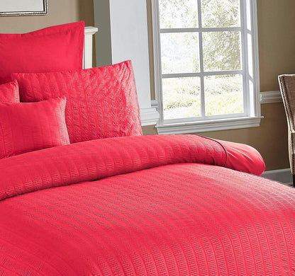 Red seersucker duvet cover with textured stripe pattern and matching pillow shams