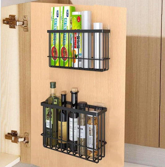 Set of 2 black wire wall storage boxes mounted on a wooden cabinet door