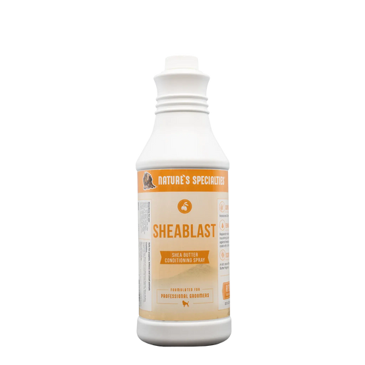 Hair conditioning spray bottle with Sheablast label, white cap, orange-and-tan front.