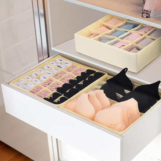 Beige drawer sock organizer with open compartments for folded socks