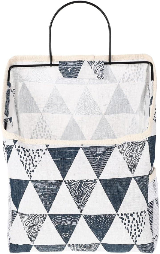 Geometric navy-and-white fabric wall organizer with top handle and open pocket design