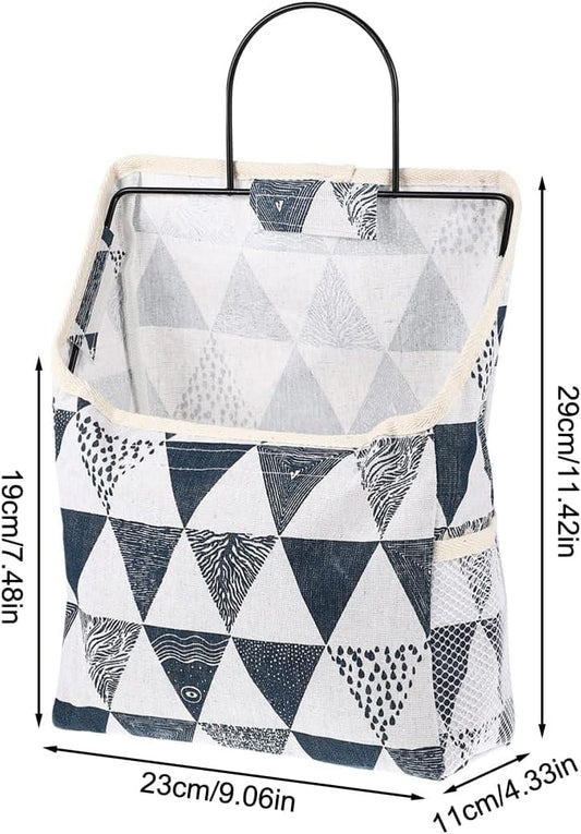 Navy-and-white geometric fabric wall hanging organizer with inner pocket and carry handle