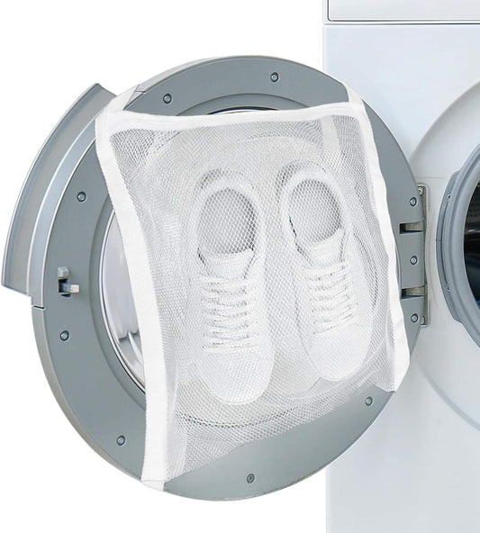 White mesh shoe wash and dry bag holding two sneakers in a dryer