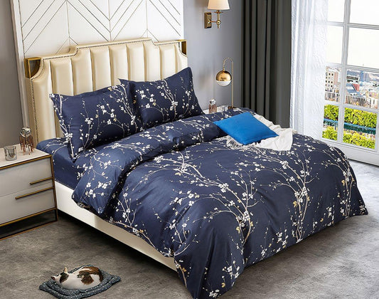 Navy floral duvet cover set with branch pattern and blue accent pillow on bed