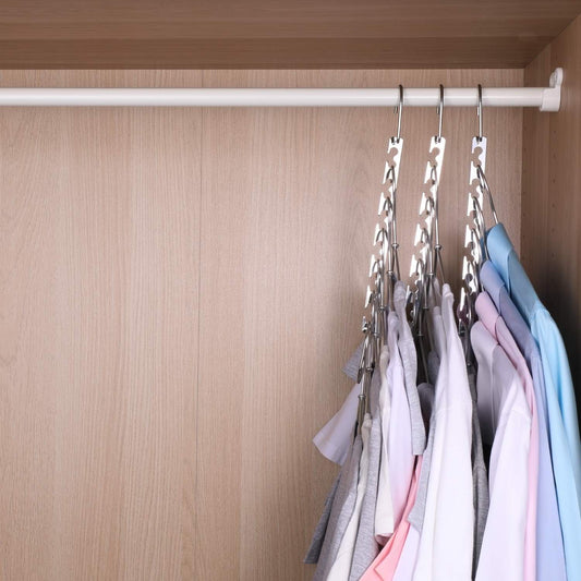 Metal cascading hanger bar holding shirts on curved hooks, chrome