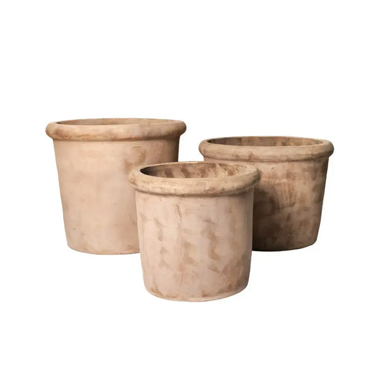Set of three concrete planter pots in light tan, squat conical shape.