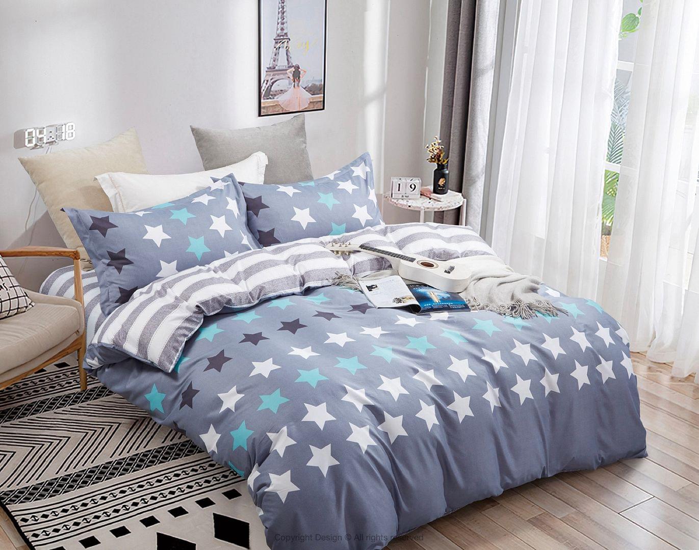 Super king quilt/duvet cover set with blue and teal star pattern and striped trim