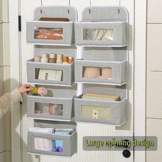 Gray multi-pocket door hanging storage bag with four open bins and small toiletries